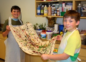 Submitted St. Helen School ninth-grader Trenton Lair, left, and eighth-grader Jimmy Adamic show off their splash painting during art camp.