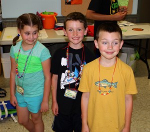 Submitted St. Helen second-graders (l to r) Meagan Passow, Luke Nedved and Jack Slattery are excited to be learning about their religion during vacation Bible school.