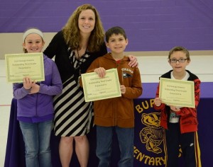 Submitted The East Geauga Kiwanis Club recently gave recognition to third-graders from Burton Elementary School for being outstanding students as chosen by their teachers. They all received a certificate and four elementary fiction books from the club. From (l to r) are Cameron Phifer, Principal Mandy Randles, Joey Strohmeier and Sam Brown.